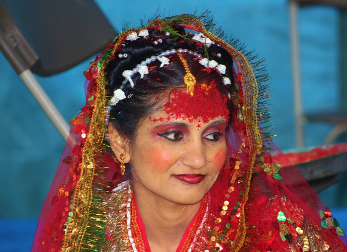 A Hindu bride, Meena Chumlagai, on her wedding day in Syracuse, NY. Bhutanese-Nepalis maintain the tradition of bringing the new bride to live with her husband’s family. May, 2013. Photographer: Andrea Kupris-Norton.