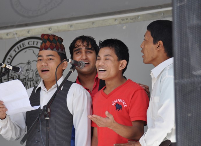 Members of the Bhutanese-Nepali Folk Collective perform at the Utica Music and Arts Festival. They share their Nepali folks songs and dances with an American audience. General Manager Tek Monger and his friends have always loved music and when they lived in Nepali refugee camps, they used to sing away their sorrows with traditional Nepali folk songs. Sept. 15, 2012. Photographer: Lynne Browne.