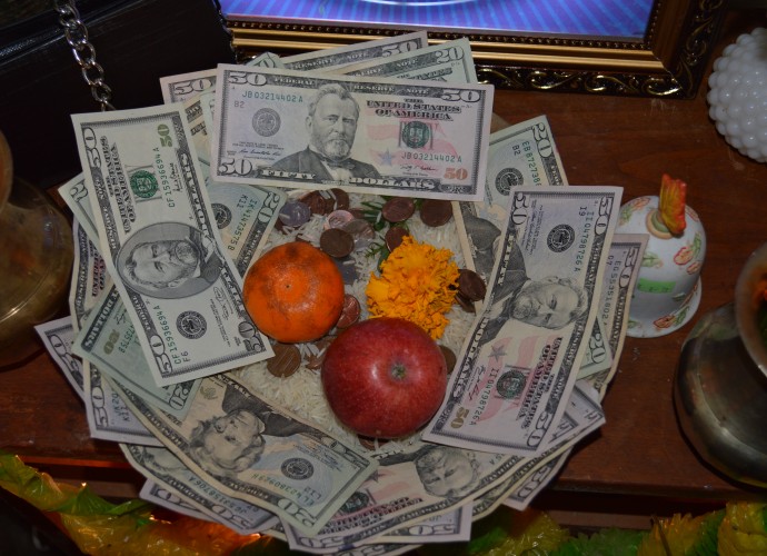 Offerings given during a puja (worship ceremony) to the goddess Laxshmi on the occasion of Deepawali. Nov. 2013. Photographer: San Acharya.