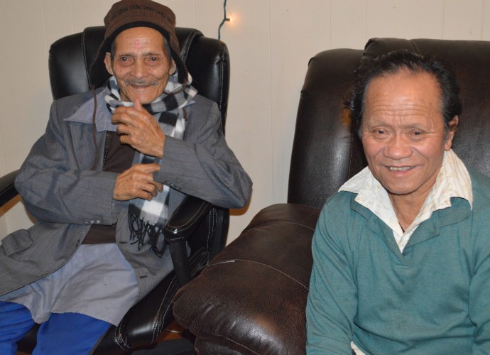 Grandpas Biswas and Monger relaxing and talking. It is often difficult for older people who do not speak much English to adjust to the changing lifestyles and community. They like to tell stories about when they were young men in Chirang, Southern Bhutan. Oct. 2013. Photographer: Krishna Adhikari.