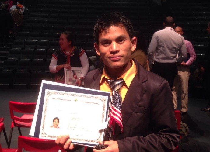 Tek Monger is the first Bhutanese-Nepali refugee living in Utica, NY to become a citizen. Dec. 2013. The United States government requires five years of residency and a passing grade on the citizenship test. Bhutanese-Nepali youth are concerned that their parents and grandparents may not be able to become citizens due to difficulties with learning English and taking the citizenship test. Although they will have the right to remain as refugees in the U.S., they want citizenship for the many rights and benefits it provides. Photographer: Mon Ranamagar.