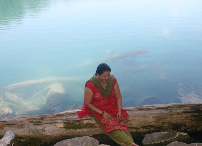 Green Lakes State Park near Syracuse, NY is a popular picnic destination and was the site of this photo taken of Nara Adhikari. The residents of Utica have many connections with the larger Bhutanese-Nepali community in Syracuse and some people go there often for visiting and shopping at the Nepali stores. July, 2012. Photographer: Terrin Munawet.