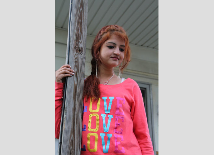 This photograph was taken of high school student Lovely Humagai at the wedding of a neighbor. There is no Hindu temple in the city so ceremonies are done at home, often with the reception held under a tent in the yard. May, 2013. Photographer: Zora Thomova.