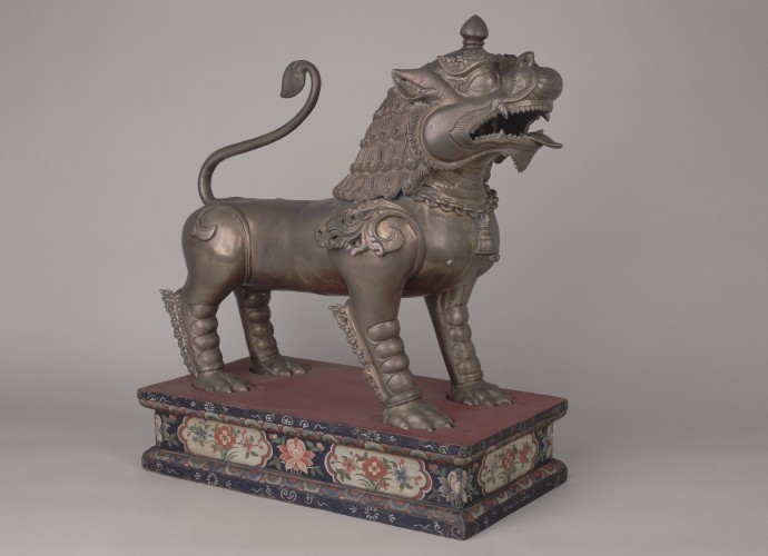 <p>One of a pair of <em> senge</em> (guardian lions) <br />
Made in Patan, Kathmandu Valley, Nepal <br />
1908, inscribed with the Vikrama year 1965 (1908) <br />
Commissioned or bought by, Rai Sahib Laksminarayan Pradhan <br />
Gifted to, Sir Charles Bell, Political Officer for Sikkim, Bhutan and Tibet (1908-18) <br />
Courtesy of National Museums Liverpool, 50.31.20a+b <br /> </p>
<p>Rai Sahib Laksminarayan Pradhan, the son of the first Newar settler in Sikkim and subsequently powerful landlord either commissioned or bought the <em>senge</em> shortly after they were made. He gifted them to Charles Bell soon after. The year 1908 is significant as this was the year Charles Bell was appointed to the post of Political Officer in Sikkim and the year Pradhan received his imperial title, ‘Rai Sahib.’ </p>