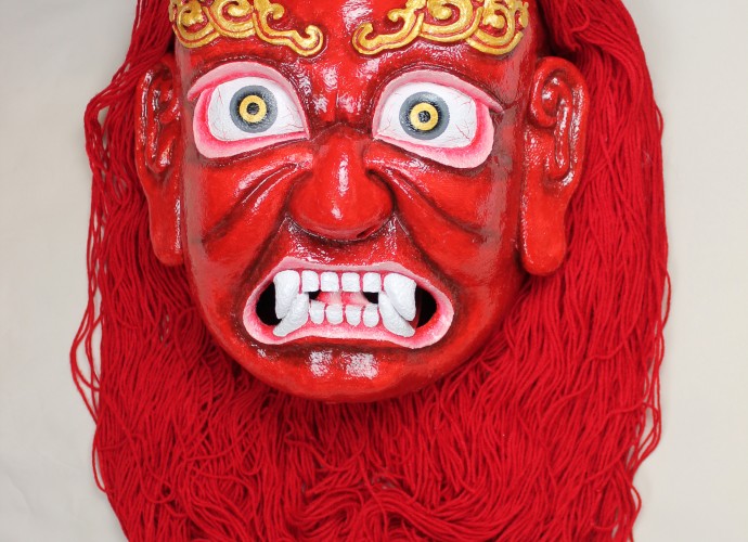 <p>Red Demoness Mask or <em>Marpo Srinmo</em> <br />
McLeod Ganj, Dharamshala, India <br />
2011 <br />
Courtesy of National Museums Liverpool, LIV.2012.40.15</p>
<p>Since 2011, NML has been working with the Tibetan Institute of Performing Arts (TIPA) based in Dharamshala, Himachal Pradesh to create a material and visual archive of <em>ache lhamo</em> (Tib. a lce lha mo) for the museum’s permanent collection. While the intangible heritage of <em>ache lhamo</em> - a Tibetan opera - has received growing attention, the material culture of <em>ache lhamo</em> is underrepresented in UK museum collections. Before the 1950s, <em>ache lhamo</em> was performed by peripatetic actors who moved from town to village criss-crossing Tibet, Sikkim and the wider Himalayan region. Since the 1980s <em>ache lhamo</em> has been remade and has become a visible marker of Tibetanness in exile. </p>
