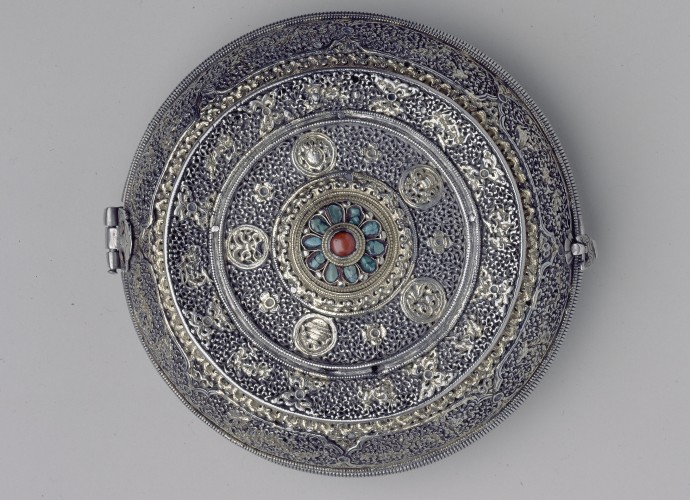 <p>Lime Box or <em>trimi</em> <br />
Bhutan <br />
Late 19th or early 20th century <br />
John Claude White collection <br />
Courtesy of National Museums Liverpool, 56.27.232</p>
<p>John Claude White presented his Tibetan and Himalayan objects based on their aesthetic values. His collection not only contained religious objects, but objects owned and coveted by the aristocratic elites of the Himalaya. He especially respected the skills of the region’s metal workers and silversmiths and his collection is notable for its weapons and armour (some taken during the bloody campaign of Younghusband in 1904). He was also gifted high status pieces by the ruler’s of Sikkim and Bhutan, including a number of lime boxes or <em>trimi</em>. John Claude White made diplomatic visits to Bhutan in 1905 and 1907 and these lime boxes are likely to have been presented to him as diplomatic gifts during one of these Anglo-Bhutanese encounters. </p>