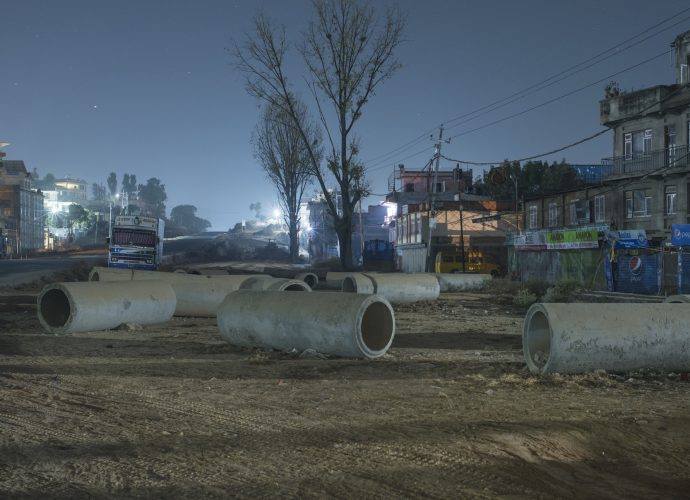 Heavy concrete pipes are being installed on the side of the road at Jhamsikhel. (Kumar, December 2, 2016).