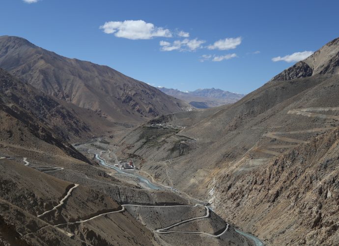 From Nara La pass, looking north towards Sher village in Tibet (China), September 2017.
The road winding down from the left is the road from the Nara La to Hilsa. Along the river is the road to Tibet, and winding up from the bridge on the right is the road to Limi Valley located in the northernmost corner of Humla. The village on the other side of the river is Sher, the nearest Tibetan village on the Nepali border, and below the village is the newly built Chinese customs and immigration building. The Karnali river flows down from Tibet to Nepal through Hilsa.