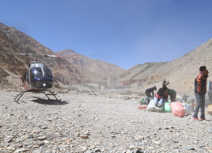Helicopter taking off from Hilsa, September 2017.
Roughly 13,000 Indian pilgrims visited Mt. Kailash through the Simikot – Hilsa route in 2017, nearly all of whom were air-lifted by helicopters from Simikot to Hilsa.* Locals along the Simikot – Hilsa route complain of not benefiting from this mass influx of pilgrims who come and go by air, while the newly elected local governments discuss ways to distribute the benefit of this economy within Humla. “One of the ways,” local youth Pema Tharchin says, “is to finish the construction of the road so pilgrims can drive instead of flying.” Meanwhile, new guest houses are under construction in Simikot and Hilsa amidst uncertainties of the pilgrim and trekking economy, which has skyrocketed after the shutdown of another border leading to Tibet in Kodari following the 2015 earthquakes in Nepal.
* ‘Kailash Manasarovar Yatra likely to see record numbers,’ The Kathmandu Post, 16 May 2018.