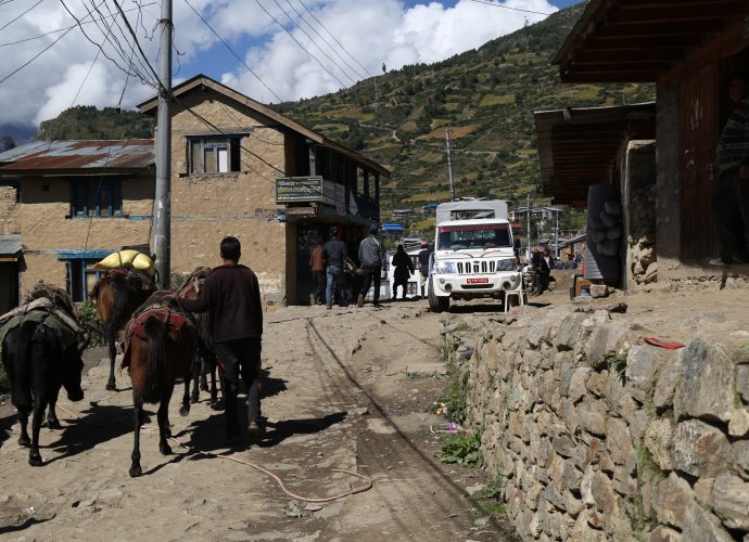 Simikot, September 2017.
Simikot, Nepal’s highest district headquarters located at 2,900m, is at the crossroad of wheels and hoofs like many Himalayan settlements. The busy street that runs through the short market is paved with stones and rubble. Until very recently, only people, livestock, and animal caravans were seen on the streets. But now occasional jeeps and tractors also make their way through the market. Unlike in Hilsa, Yari, Tumkot, and Yalbang where Chinese Dongfeng trucks are used, jeeps and tractors in Simikot are airlifted from within Nepal, and have valid registration plates.