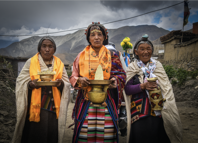 Wedding Ritual. (Yungdrung Tsewang, May 2016)
Wedding reception in the Jharkot village of Mustang, Nepal. Women carrying torma (T. religious sculpture of dough prepared out of flour) in the center, and chang and arak (locally-made alcohol), sing and welcome a newlywed couple to give them blessings for a prosperous future.