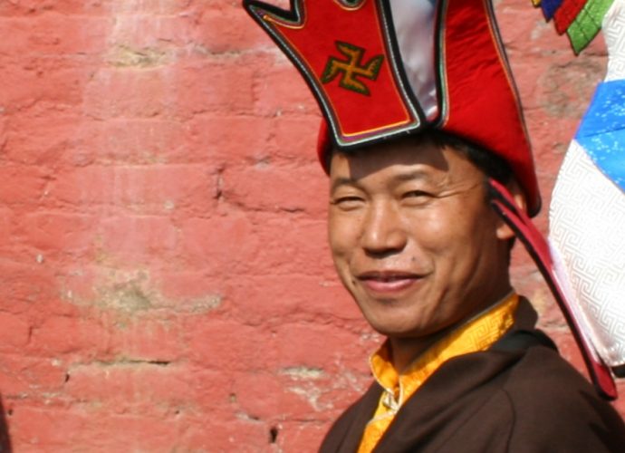 Amchi Nyima, the main Sowa Rigpa practitioner of the monastery, who was assigned the task of compounding the mendrup medicine. He is wearing the typical Bonpo white-blue hat with the auspicious sign of the left-turned swastika (dkar mo khyung gshog). Here, he is taking part in a procession which formed a part of the mendrup ritual.
