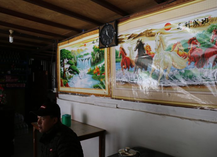 Inside a local eatery, Ghattekhola. Ghattekhola village is approximately one mile south of the Rasuwagadhi border. It used to be a small village with only about a dozen households, but is quickly growing into a vibrant site for trade and other activities along the Rasuwagadhi corridor. Apart from local eateries and hotels catering to the truckers and locals crossing the border, it also houses a temporary immigration office, a border police station, and several motor workshops.