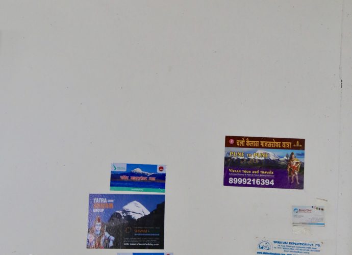 The reception wall of a hotel in Ghattekhola, Rasuwa. With an increasing number of Mount Kailash yatri (Nepali. pilgrims), particulalry from India, the hotels along the road have become more profitable. This is a wall of a hotel in Ghattekhola. Often, Indian Kailash yatri have to wait a day or two in Rasuwa to get their visa before entering into Tibet Autonomous Region, China to commence the yatra (journey).