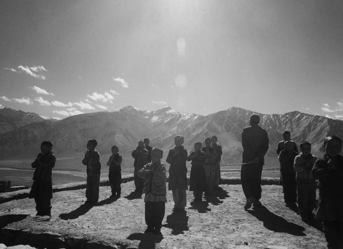 On the opposite hill, the nunnery school day begins with a Manjushri (Buddhist patron of wisdom and learning) prayer recited out loud by a group of young girl-students, under the watchful eye of Tsering Namgyal, a resident monk-teacher from neighboring Ladakh. The lama has been sent to Zanskar by the Central Institute of Buddhist Studies (CIBS) near Leh. The teaching position in remote and underdeveloped Zanskar, far away from family and friends, is seen more in terms of a burdensome undertaking, rather than a reward by the young monks. Hence, finding a teacher for the gompa school often proves to be a difficult task, even though the monk teachers are provided with boarding, lodging, and a regular salary for the job, as well as complete freedom in their classroom curriculum design. 