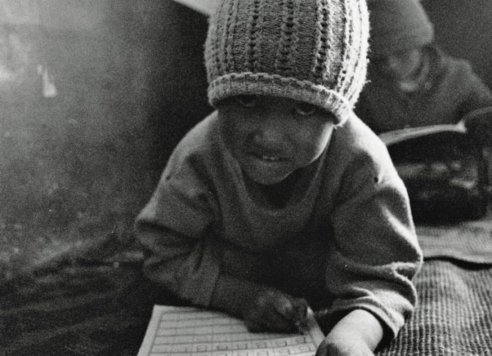In the nunnery classroom, little Dolma is learning the English alphabet. Bananas are rarely available in the highland semi-desert, yet they are a standard item in Indian schoolbooks for English. Many items like this function on a somewhat abstract level for Zanskari children. The images of objects and concepts from the wider world travel faster than direct experiences of these things, making language learning abstracted from the surrounding everyday reality. At the same time, books are providing children with a simplified glimpse of what might lie beyond their local area. 
